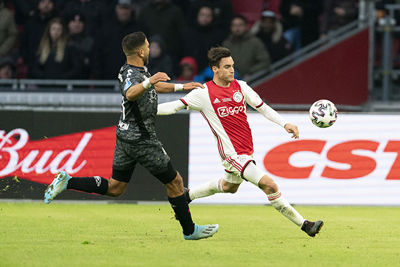 AMSTERDAM, 19-01-2020 JohanCruyff Arena , Dutch Eredivisie Football season 2019 / 2020 . Sparta player Mohamed Rayhi  and Ajax player Nico Tagliafico  during the match Ajax - Sparta Rotterdam