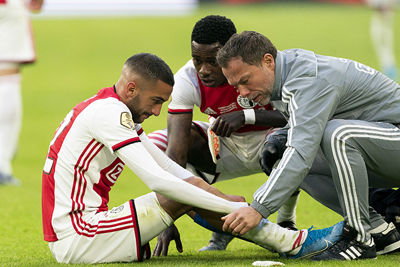 AMSTERDAM, 19-01-2020 JohanCruyff Arena , Dutch Eredivisie Football season 2019 / 2020 . Ajax player Hakim Ziyech  and Ajax player Quincy Promes   during the match Ajax - Sparta Rotterdam